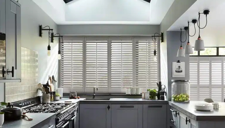 White full height shutters in a modern kitchen