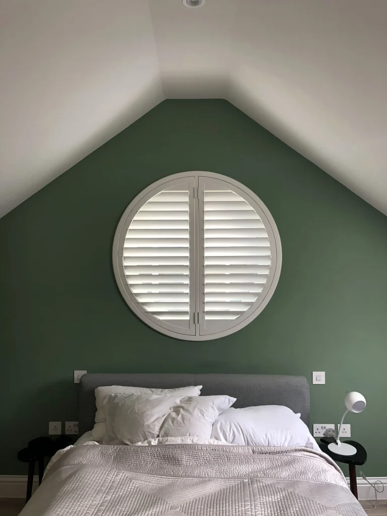 Round special shape shutters in a modern bedroom