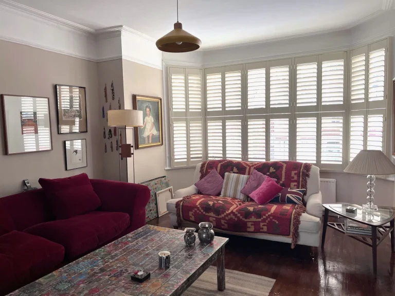 Tier on tier shutters in a cozy living room