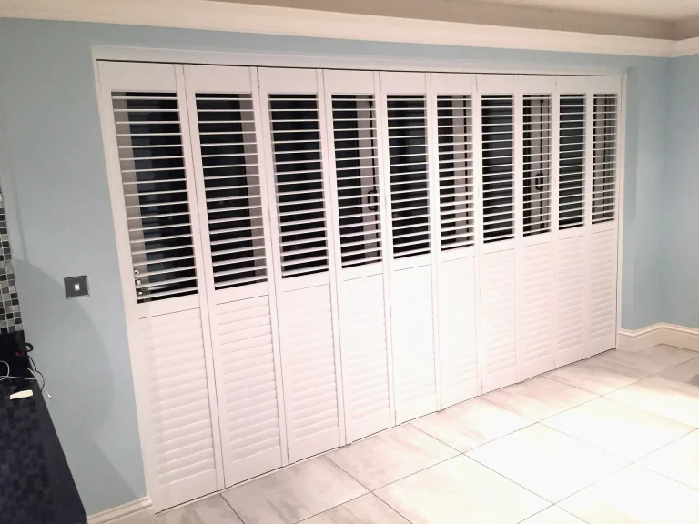 White track shutters used as room dividers