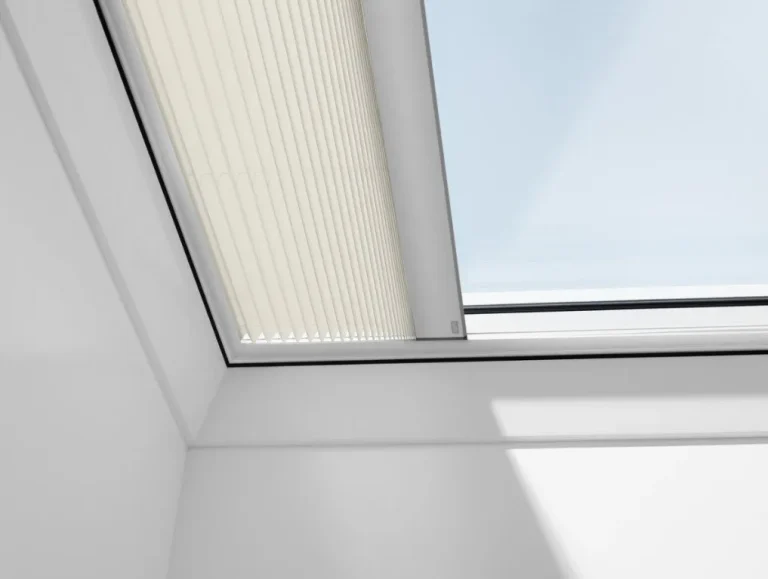 White pleated velux blinds in a loft skylight