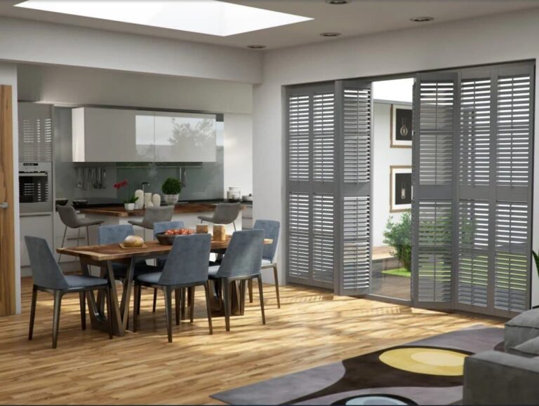 High-quality window treatments featuring custom-made grey shutters in a modern dining and kitchen area