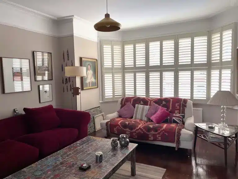 Classic wooden window shutters in a modern North London kitchen and dining area