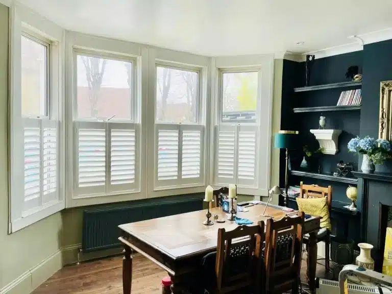 Custom bay window shutters installed by a local shutter manufacturer in North London