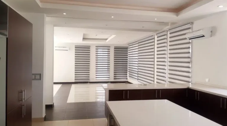 Living room with stylish minimalist plantation shutters by North London Shutters and Blinds