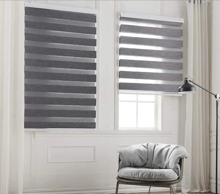 Stylish gray zebra blinds alternative to wood interior shutters in a contemporary living space with white walls and minimalist decor