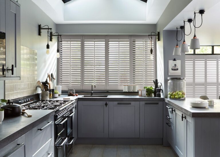 Contemporary kitchen featuring wooden shutters internal by North London Shutters and Blinds