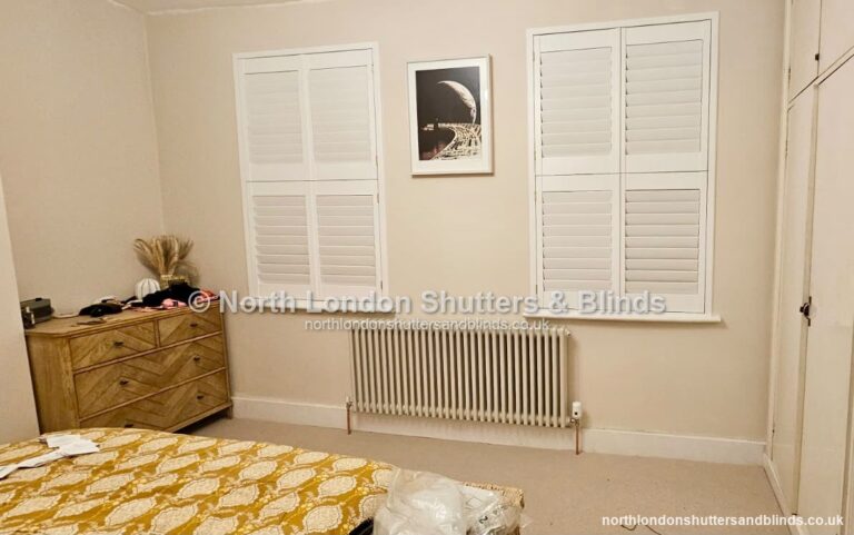 White full height plantation shutters in a bedroom by shutter fitters in Barnet, North London