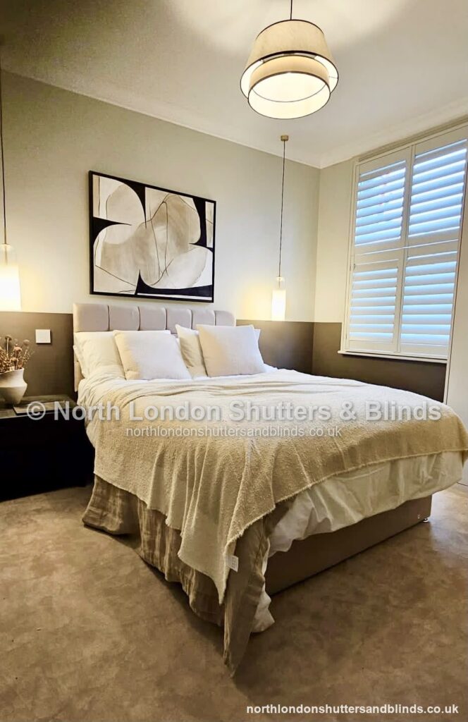 White full height plantation shutters in a bedroom by shutter fitters in Barnet, North London