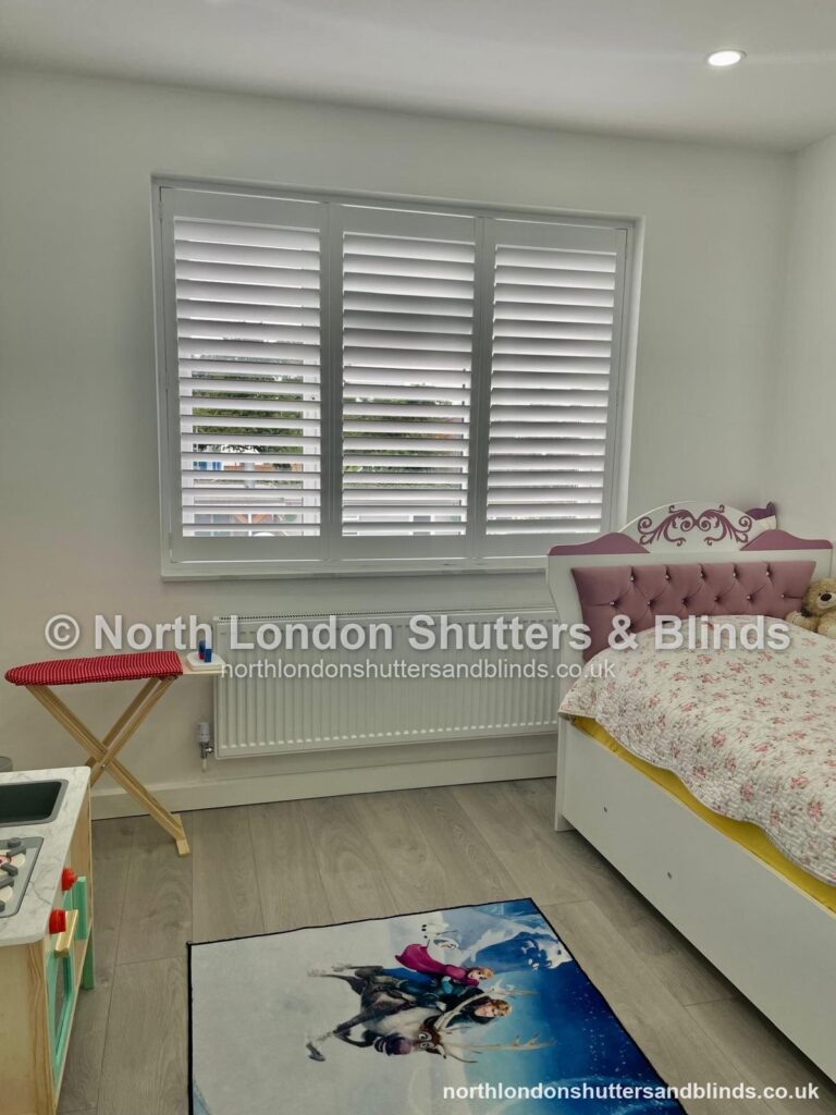 White full height plantation shutters in a children's bedroom by shutter fitters in Barnet, North London