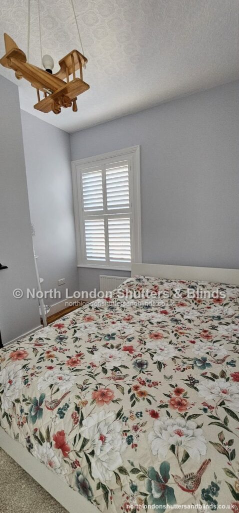 White full height plantation shutters in a children's bedroom by shutter fitters in Barnet, North London