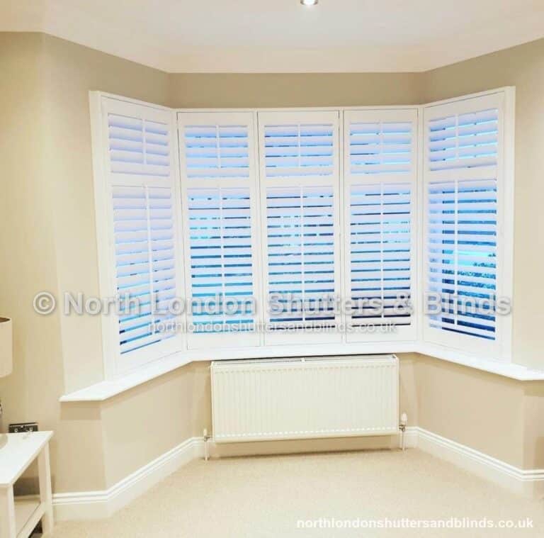 White full height plantation shutters on a bay window by shutter fitters in Barnet, North London