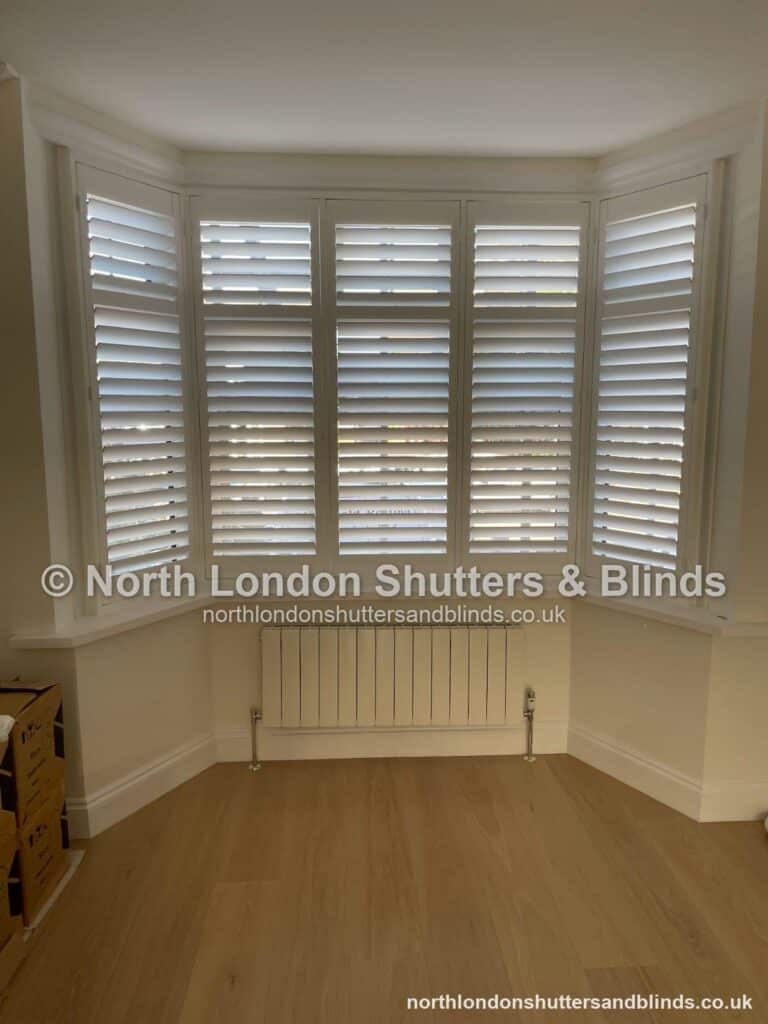 White full height plantation shutters on a bay window by shutter fitters in Barnet, North London
