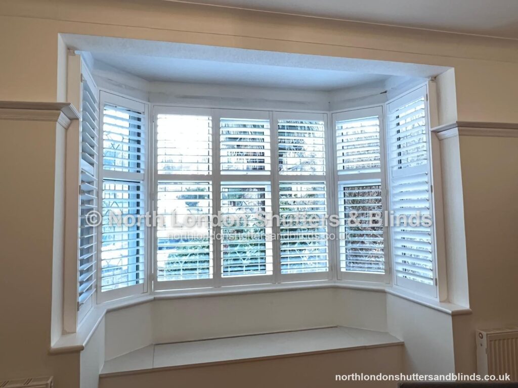 White full height plantation shutters on a bay window by shutter fitters in Barnet, North London