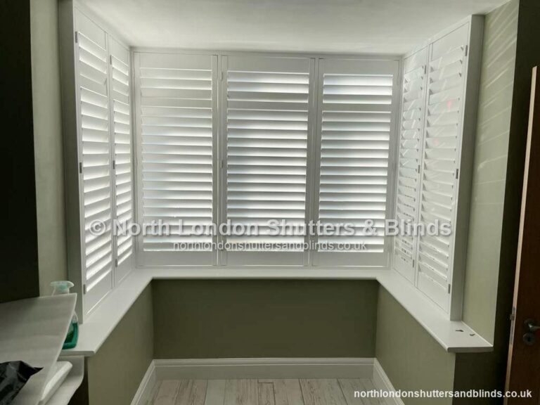 White full height plantation shutters on a bay window by shutter fitters in Barnet, North London