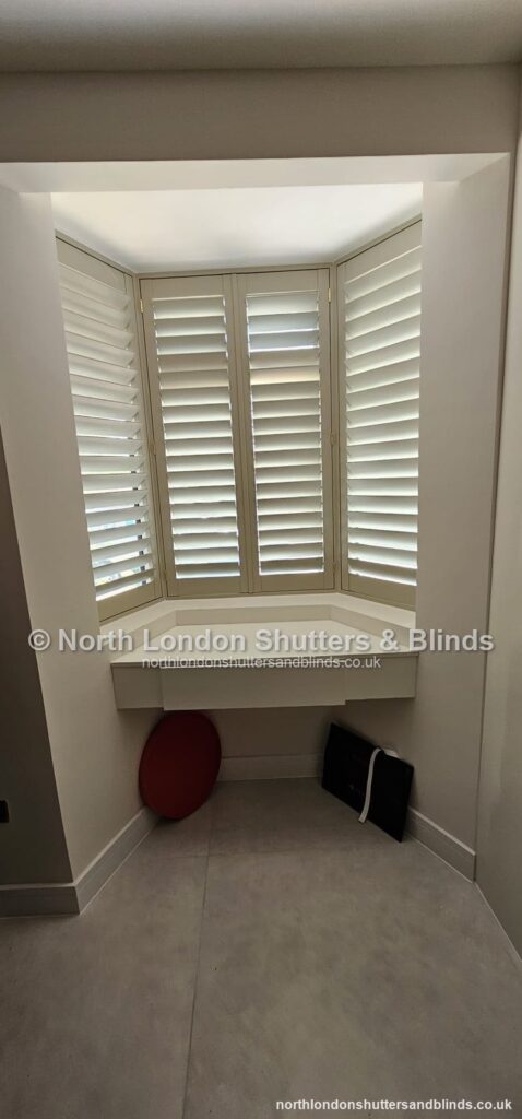 White full height plantation shutters on a bay window by shutter fitters in Barnet, North London
