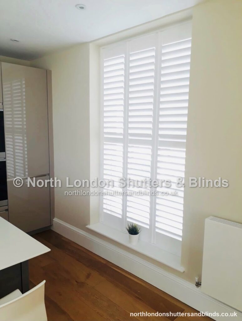 White full height plantation shutters in a kitchen by shutter fitters in Barnet, North London