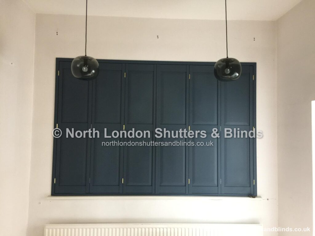 Navy blue solid panel shutters by shutter fitters in Barnet, North London