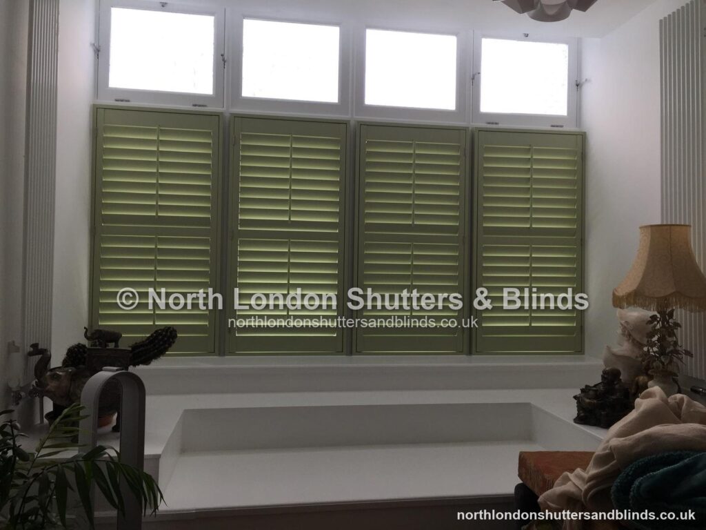 Sage green café style plantation shutters by shutter fitters in Barnet, North London
